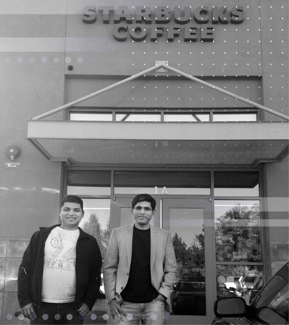 The cofounders Ajeet and Amit standing in front of a Starbucks.