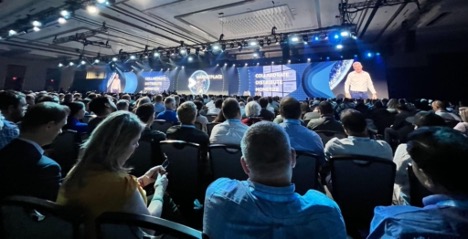 People watching a speaker at the snowflake summit.